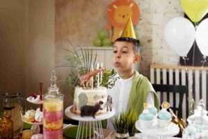 side view kid blowing candles 11zon instore activations, family days, carnivals and birthdays