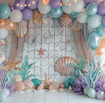 A colorful room with a rainbow balloon arch and a couch. The room is decorated with balloons and has a fun, playful atmosphere